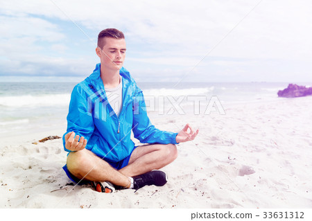 Man training on beach outside Man training on beach outside 33631312