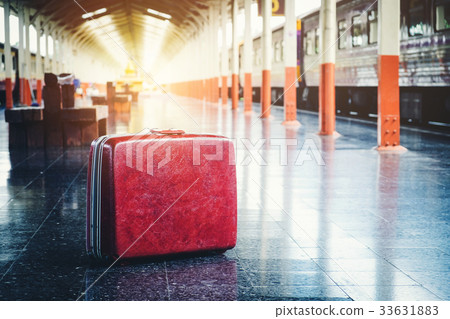 Bag and trip at train station 33631883