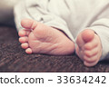 Baby's feet 33634242