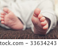 Baby's feet 33634243