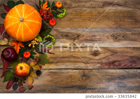 Happy Thanksgiving decor with fall leaves on wood 33635842