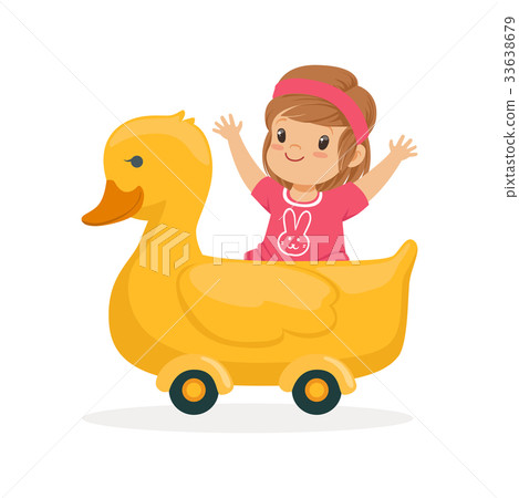 Cute little girl riding on yellow duck, kid have a 33638679