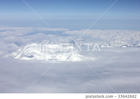 Autumn Arctic Circle seen from the clouds, snow covered mountainous region of Alaska 33642682