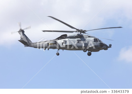 US Navy's ship-mounted SH-60B seahawk anti-submersible helicopter flying over a dense forest in Florida US Navy's ship-mounted SH-60B seahawk anti-submersible helicopter flying over a dense forest in Florida 33643379