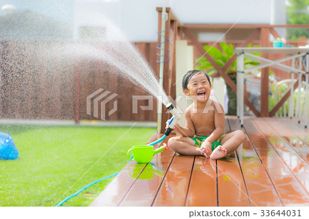 Garden wood deck lawn boy water play 33644031