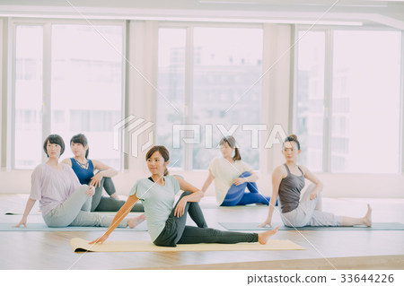 Young woman doing yoga in yoga studio 33644226