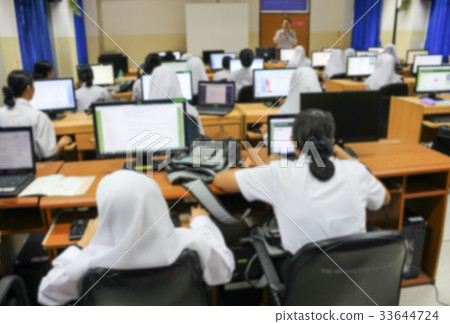 Blur Student with teacher and desktop computer Blur Student with teacher and desktop computer 33644724