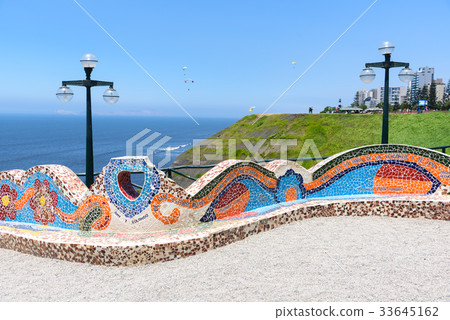 Colorful chairs in the park made with mosaic stone Colorful chairs in the park made with mosaic stone 33645162