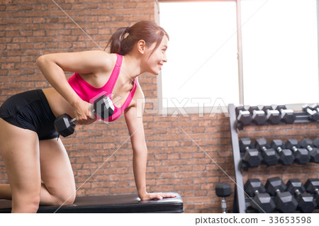 sport woman with dumbbell 33653598