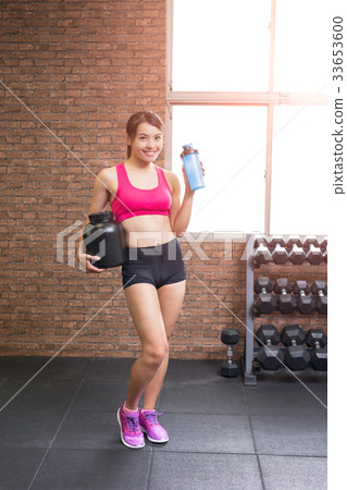 sport woman with whey protein 33653600