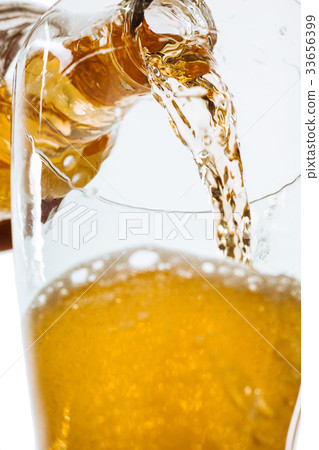 Glass of beer and bottle 33656399