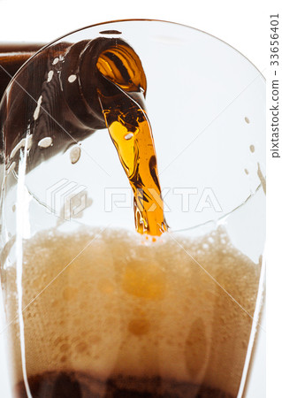 Glass of beer and bottle 33656401