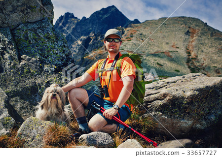 Man tourist with dog 33657727