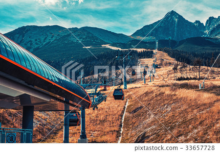Cableway in mountains 33657728