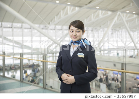 Cabin attendant standing pose 33657997