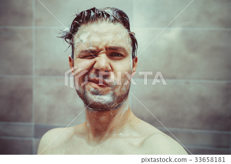 Young man washing head 33658181