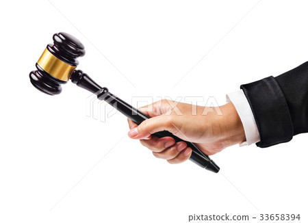 Male hand holding wooden gavel. Male hand holding wooden gavel. 33658394