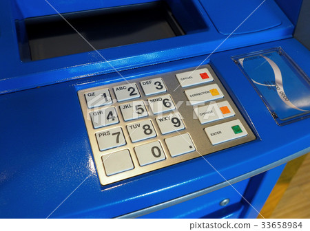 Blue color ATM machine and white button keypad. 33658984