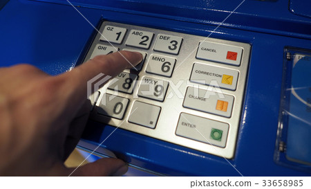 Blue color ATM machine and white button keypad. Blue color ATM machine and white button keypad. 33658985