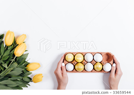 Female hand puts on the table Female hand puts on the table 33659544