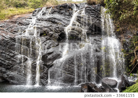 Scenic tropical waterfall Scenic tropical waterfall 33661155