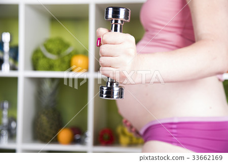 Pregnant Fitness Woman with dumbbells Pregnant Fitness Woman with dumbbells 33662169