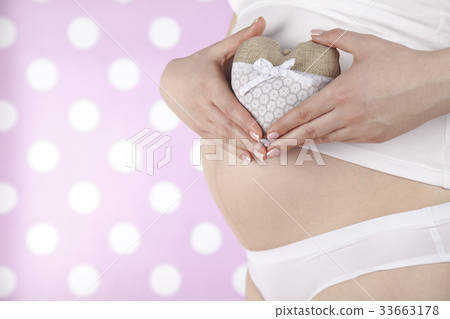 Close up of a cute pregnant belly, Heart Close up of a cute pregnant belly, Heart 33663178