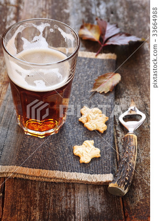 Autumn mood: glass of light beer and crackers Autumn mood: glass of light beer and crackers 33664988