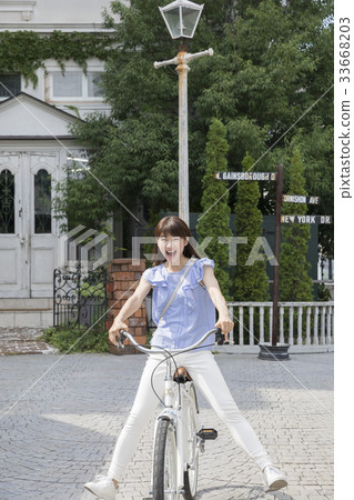 Woman going out on a bike Woman going out on a bike 33668203