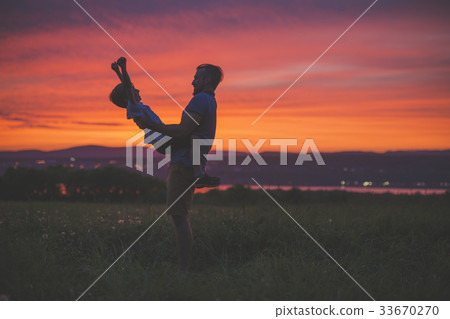 silhouette of father and son at sunset silhouette of father and son at sunset 33670270