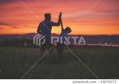 silhouette of father and son at sunset silhouette of father and son at sunset 33670271