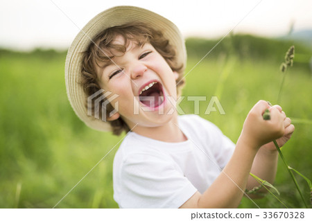 Portrait of adorable kid boy with hat standing on 33670328