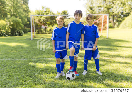 three, Young boy with soccer ball on a sport 33670787