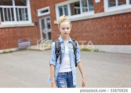 Nice Pre-teen boy outside at school having good Nice Pre-teen boy outside at school having good 33670826