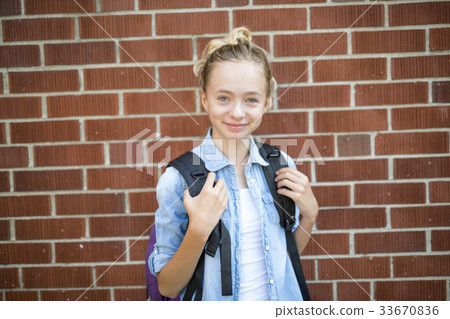 Nice Pre-teen boy outside at school having good Nice Pre-teen boy outside at school having good 33670836