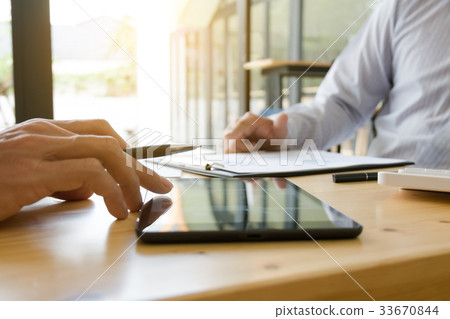 Businessman working together and using tablet 33670844