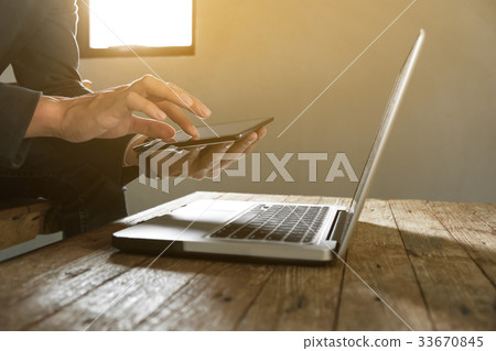 businessman working with digital tablet and laptop 33670845