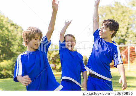 three, Young boy with soccer ball on a sport 33670996