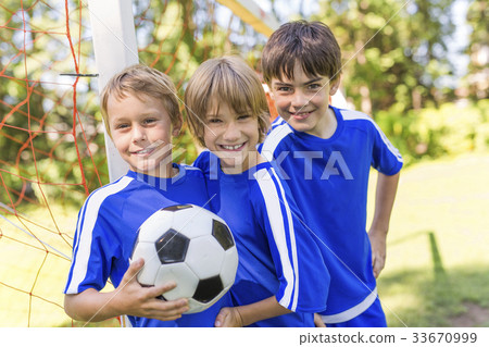 three, Young boy with soccer ball on a sport 33670999