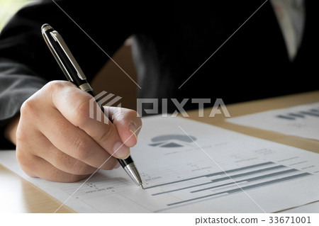 business woman hands analyzing valuation 33671001
