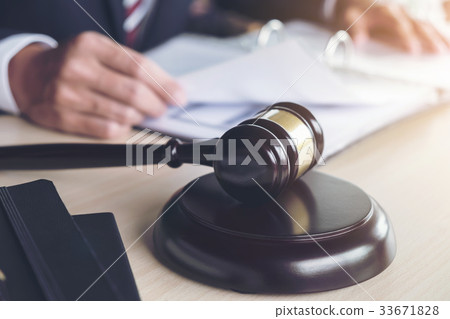 Close up of gavel, Male lawyer working with scales Close up of gavel, Male lawyer working with scales 33671828