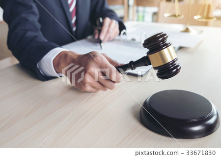 Close up of gavel, Male lawyer working with scales 33671830