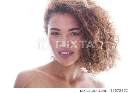 Portrait of a curly woman with freckles and naked Portrait of a curly woman with freckles and naked 33672272