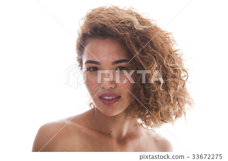 Portrait of a curly woman with freckles and naked Portrait of a curly woman with freckles and naked 33672275