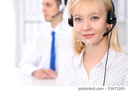Call center. Focus on beautiful woman in headset 33673263