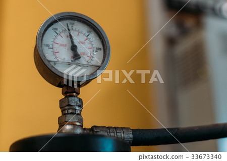 Valve of gas cylinders in a garage. Valve of gas cylinders in a garage. 33673340