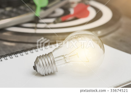 lightbulb on paper book. concept for new idea lightbulb on paper book. concept for new idea 33674521