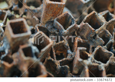 Old and rusty square pipes. Old and rusty square pipes. 33674872