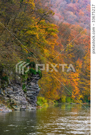 rocky cliff of mountain river background 33675217