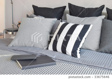 stylish bedroom with patterned pillows on bed stylish bedroom with patterned pillows on bed 33675646